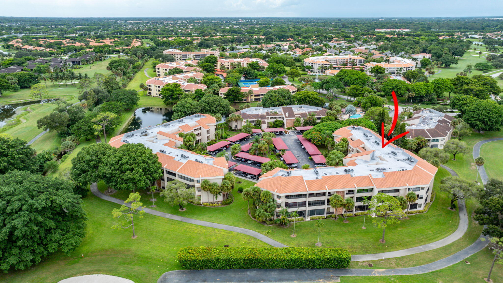 7460 La Paz Boulevard, Unit 108 Boca Raton, FL 33433 - Photo 36 of 40 an aerial view of residential houses with outdoor space and trees