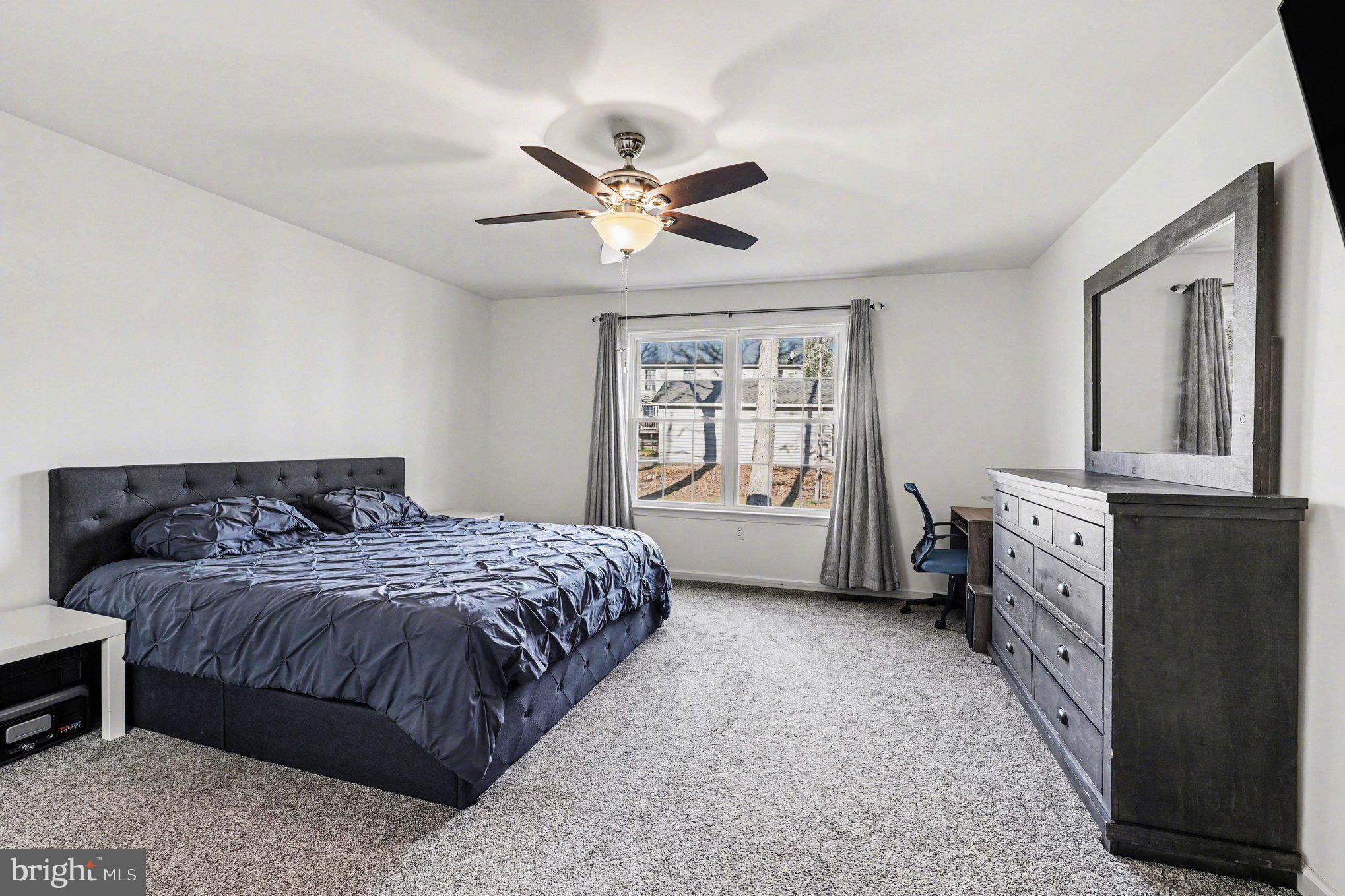 117 Butler Circle Locust Grove, VA 22508 - Photo 15 of 35 a bedroom with a bed and a window