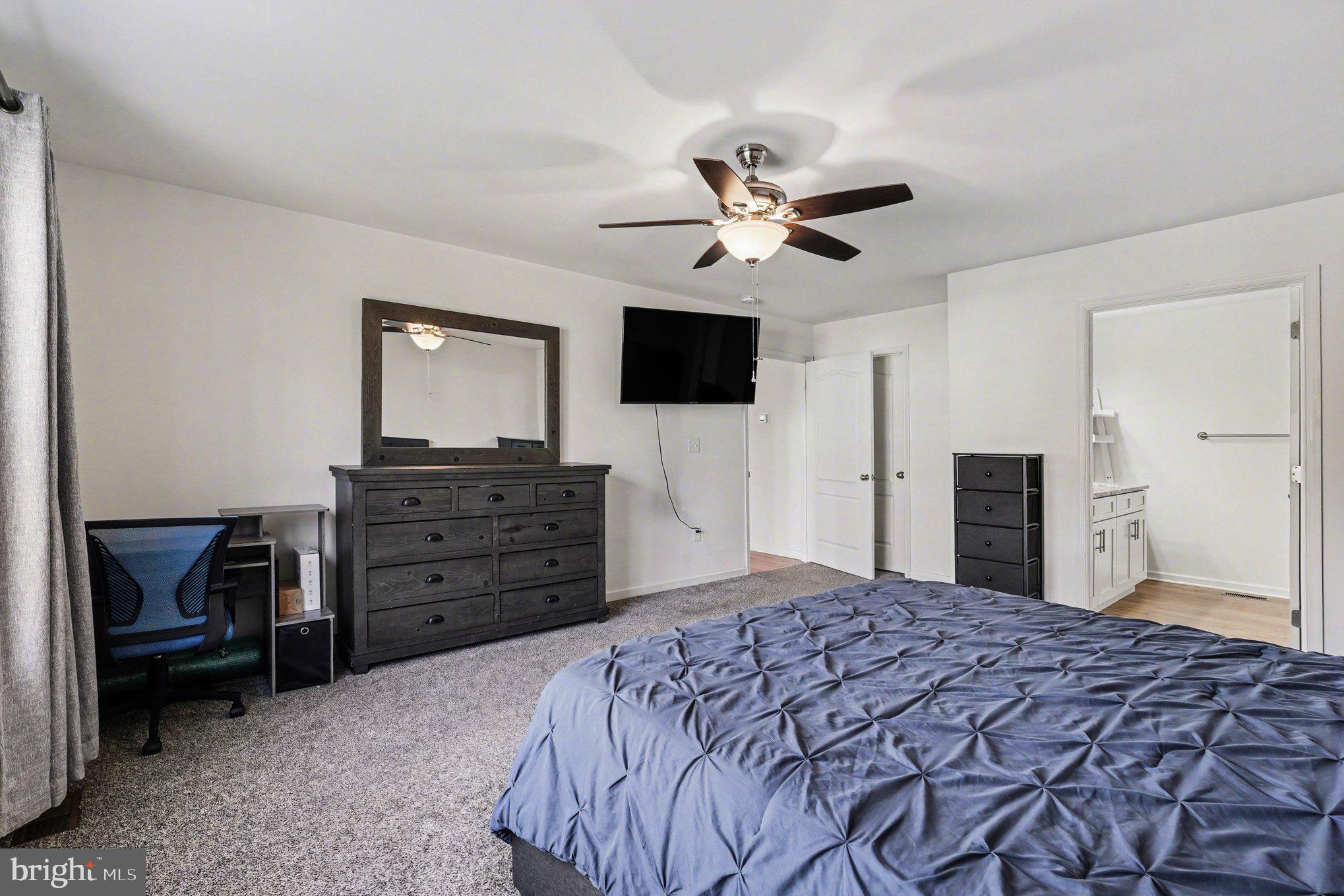 117 Butler Circle Locust Grove, VA 22508 - Photo 16 of 35 a bedroom with a bed and a television