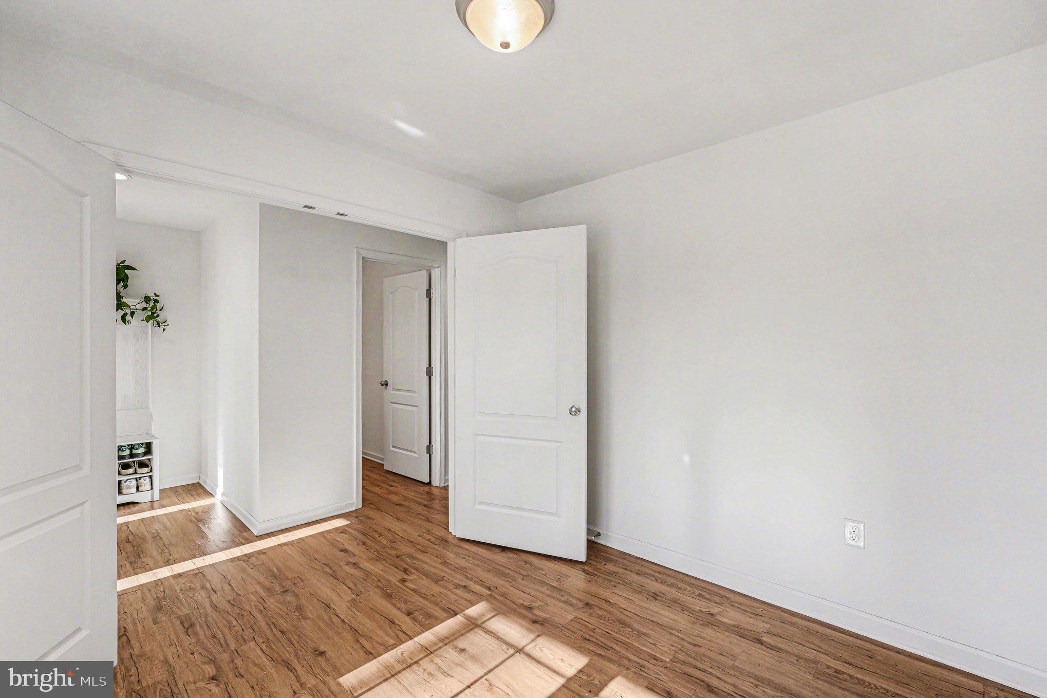117 Butler Circle Locust Grove, VA 22508 - Photo 20 of 35 a bedroom with a bed and a chandelier