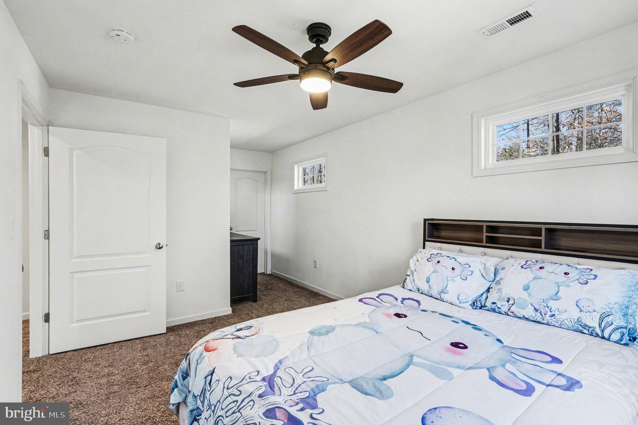 117 Butler Circle Locust Grove, VA 22508 - Photo 23 of 35 a bedroom with a bed and a ceiling fan