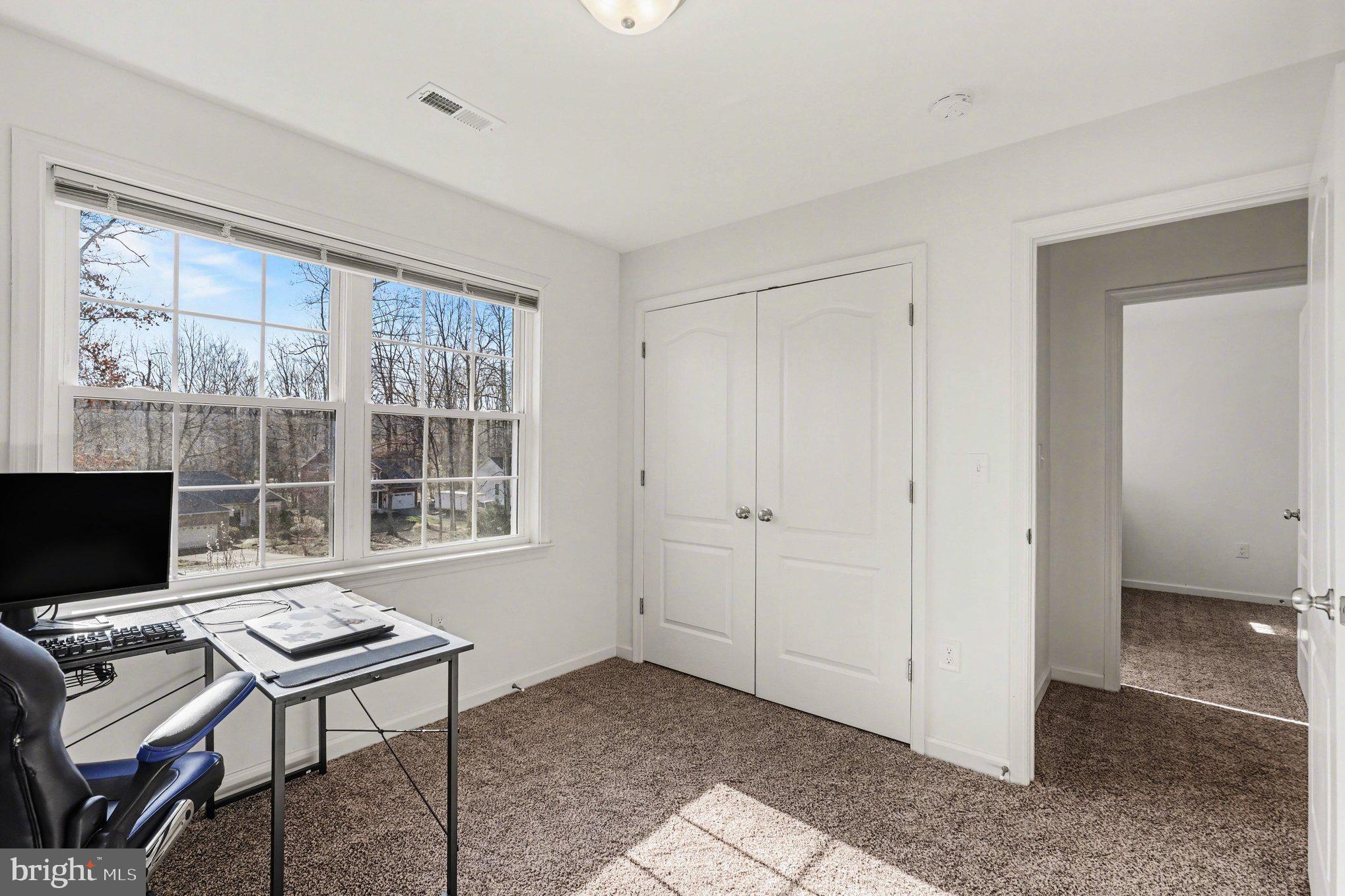 117 Butler Circle Locust Grove, VA 22508 - Photo 25 of 35 a living room with furniture a flat screen tv and a window