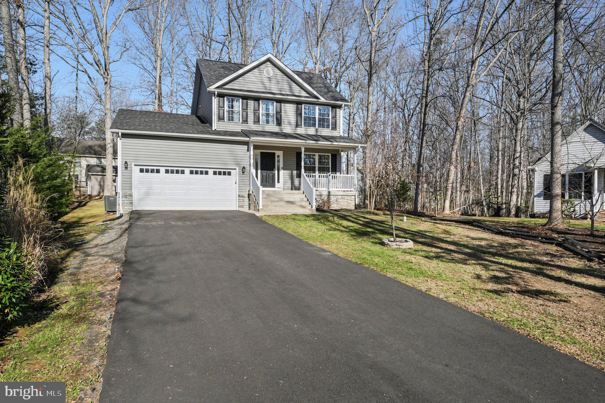 117 Butler Circle Locust Grove, VA 22508 - Photo 3 of 35 a front view of a house with a yard