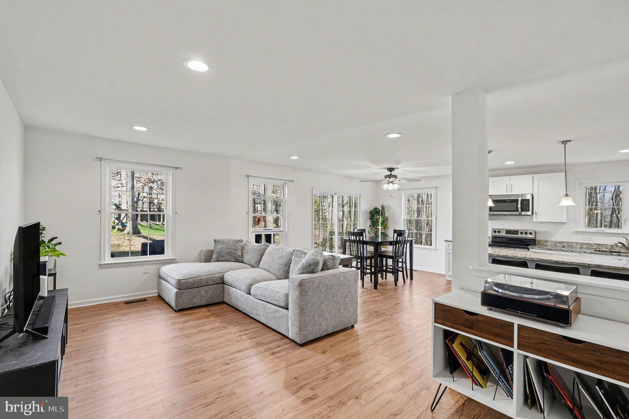 117 Butler Circle Locust Grove, VA 22508 - Photo 8 of 35 a living room with furniture and a flat screen tv