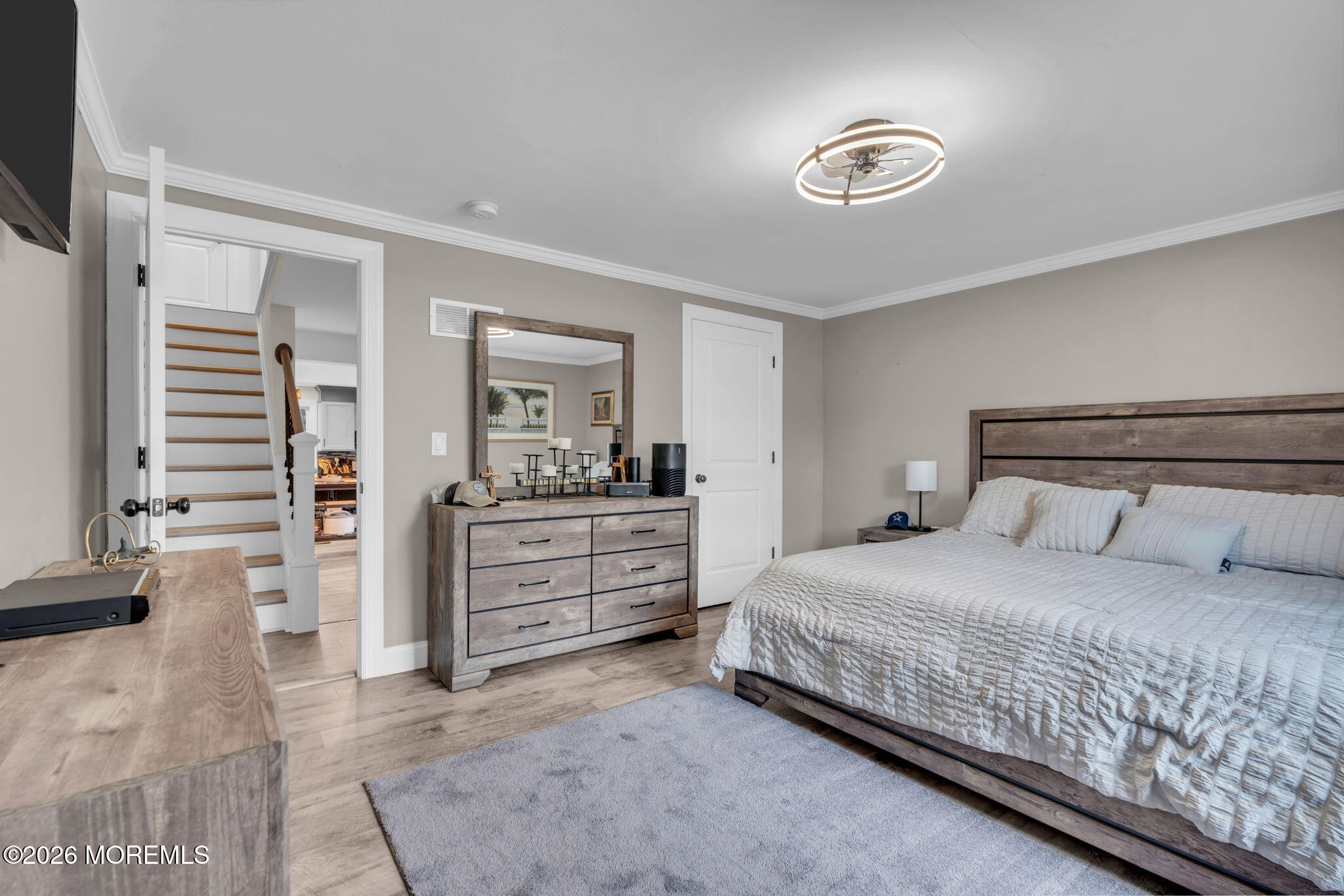 181 Locust Avenue Howell, NJ 07731 - Photo 27 of 66 a bedroom with a large bed and a dresser