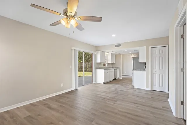 a view of a kitchen with a stove cabinets and wooden floor