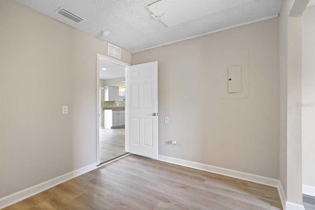 2107 Shady Point Lane Brandon, FL 33510 - Photo 19 of 38 a view of an empty room with wooden floor