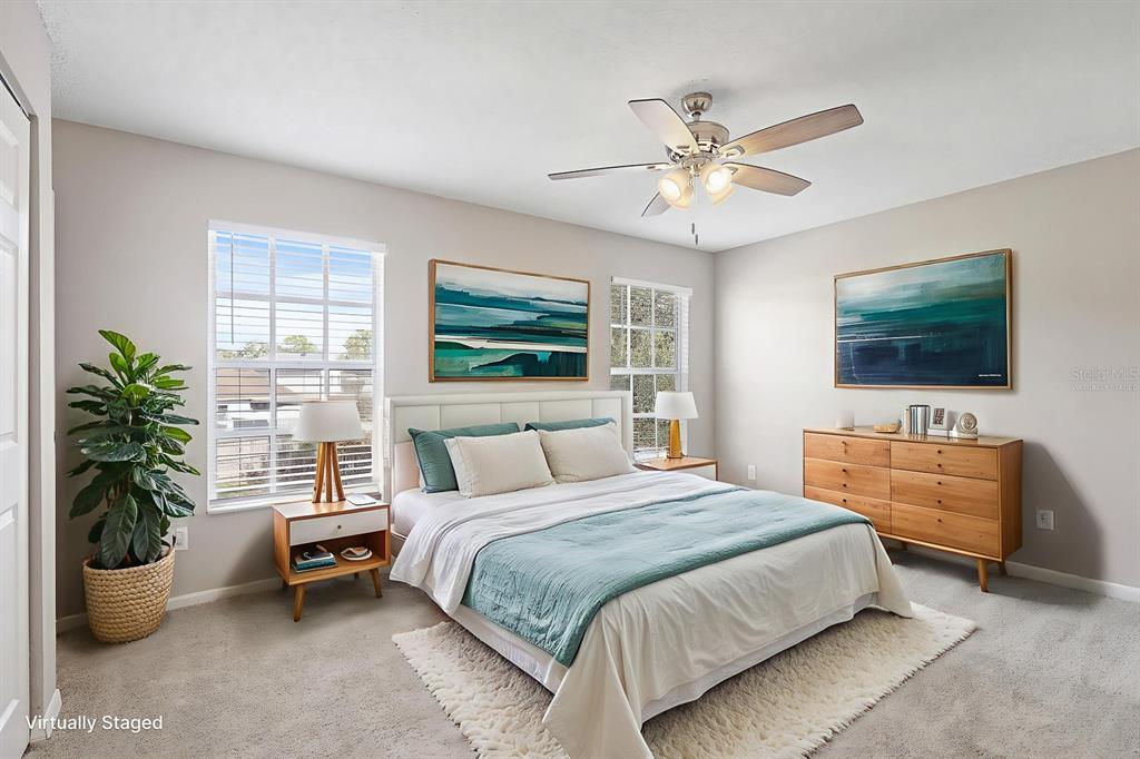 2107 Shady Point Lane Brandon, FL 33510 - Photo 21 of 38 a bedroom with a bed and a flat screen tv