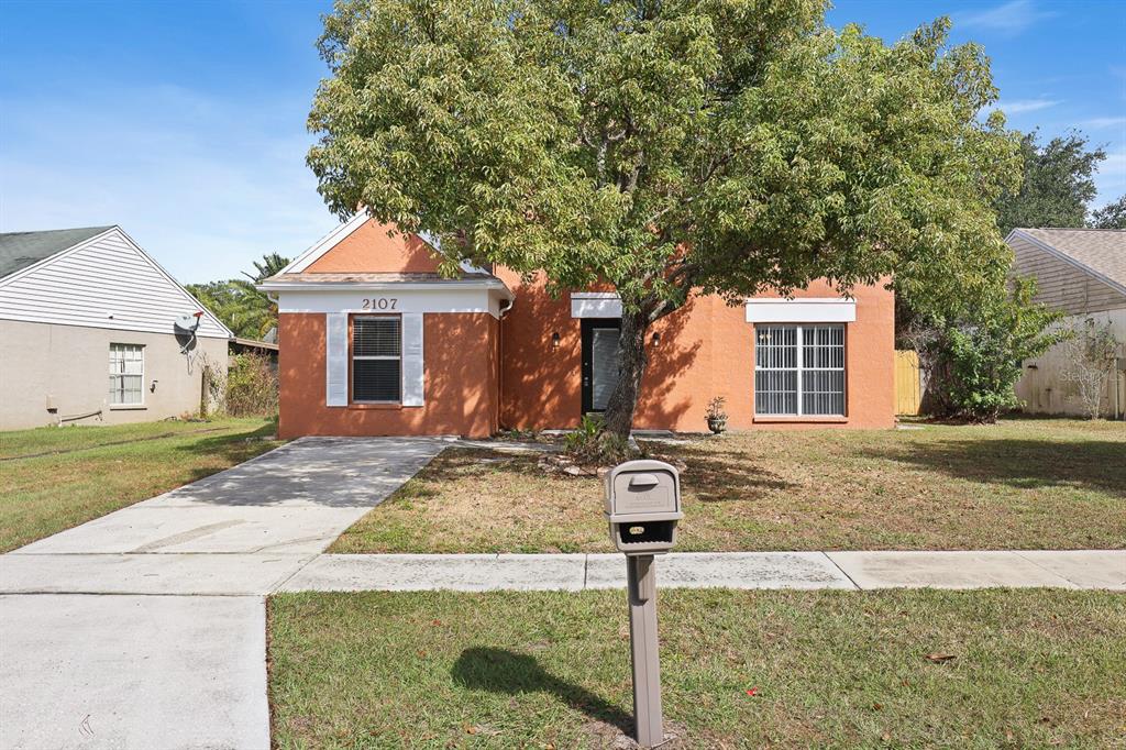 2107 Shady Point Lane Brandon, FL 33510 - Photo 32 of 38 a front view of a house with garden