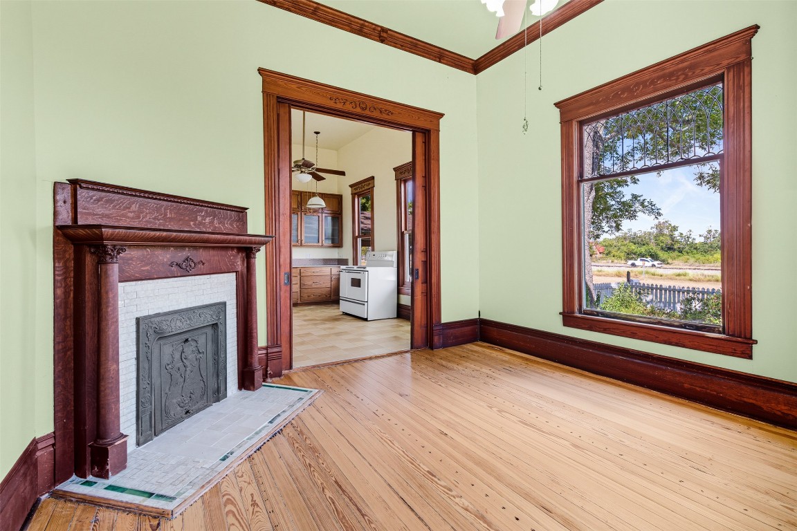 105 Davis Drive Thorndale, TX 76577 - Photo 13 of 40 a view of a livingroom with an empty space and a fireplace