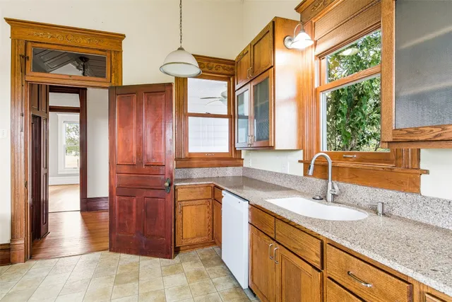 a kitchen with stainless steel appliances granite countertop a sink and a cabinets