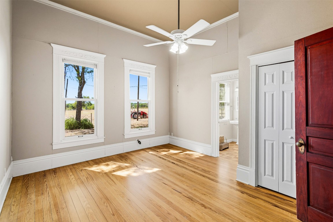 105 Davis Drive Thorndale, TX 76577 - Photo 17 of 40 wooden floor in an empty room with a window