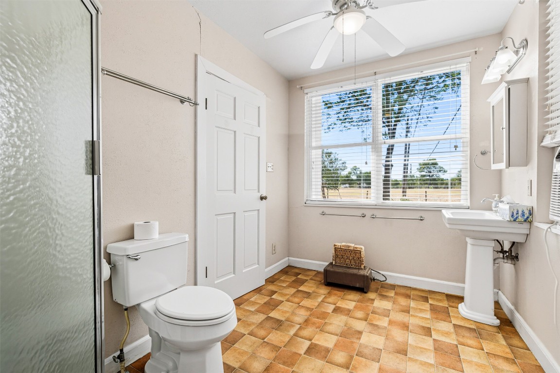 105 Davis Drive Thorndale, TX 76577 - Photo 18 of 40 a bathroom with a sink toilet and shower