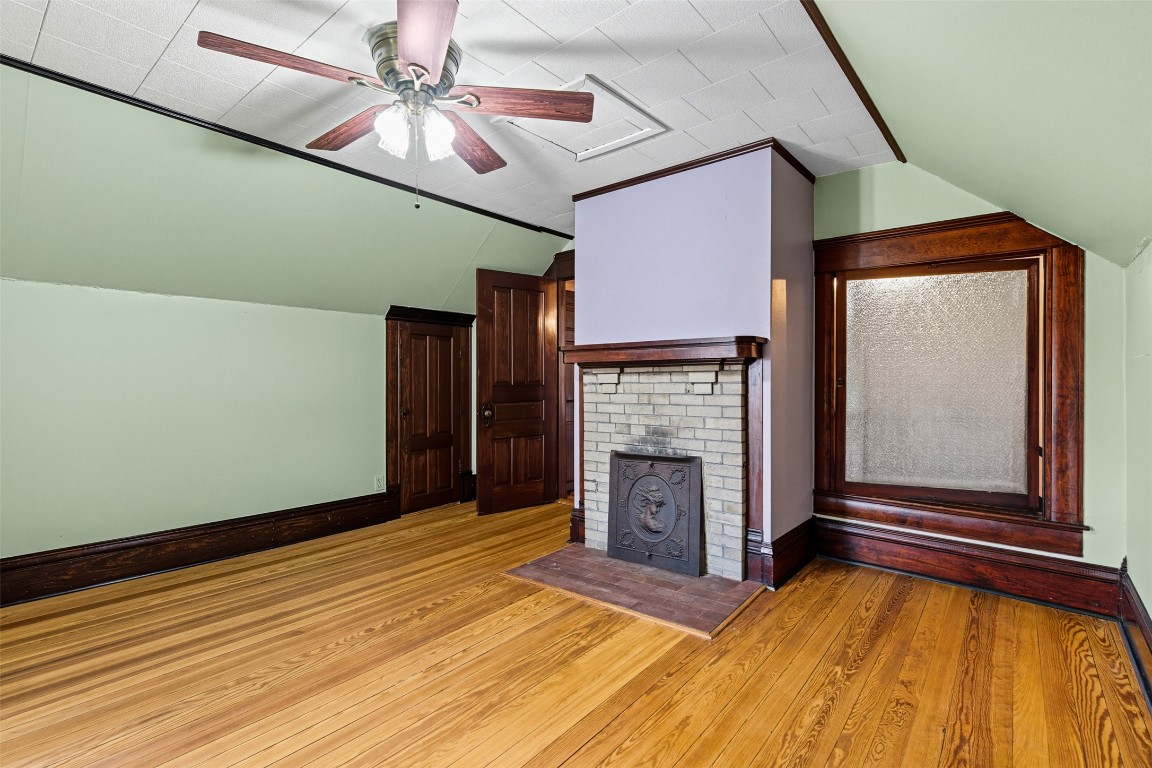 105 Davis Drive Thorndale, TX 76577 - Photo 19 of 40 a view of an empty room with a fireplace and a window