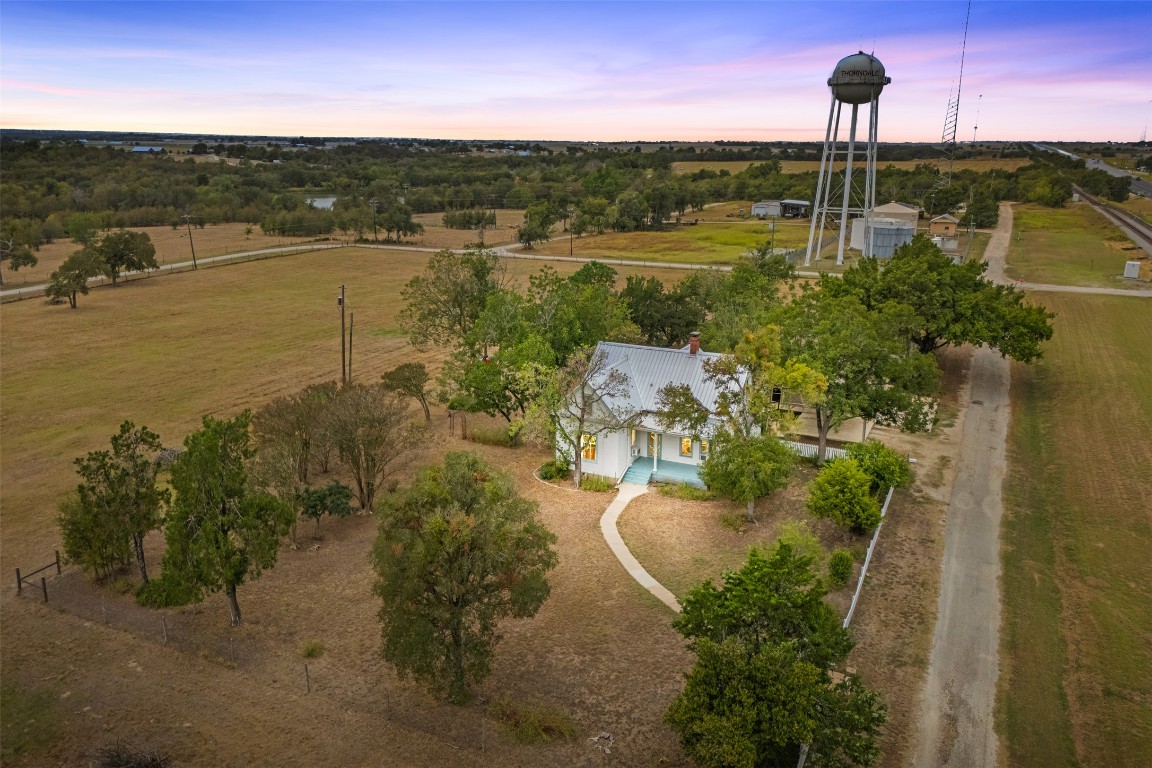 105 Davis Drive Thorndale, TX 76577 - Photo 2 of 40 a view of a lake with a house in the background