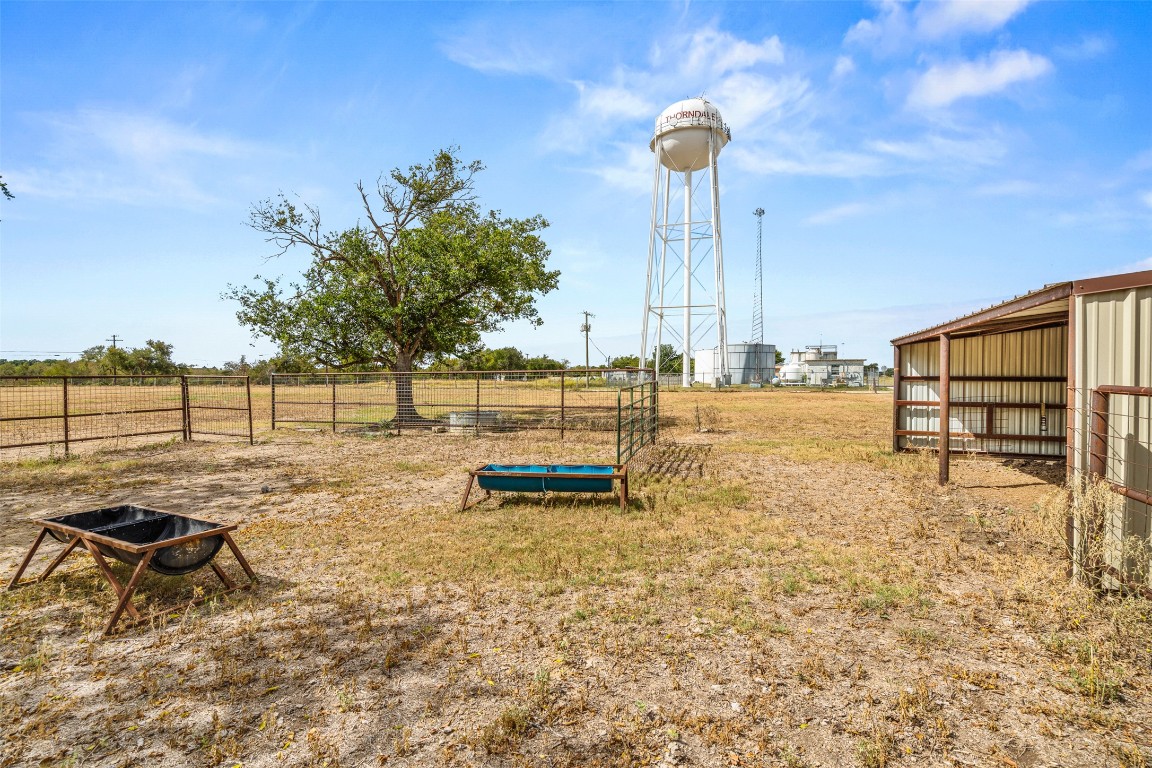 105 Davis Drive Thorndale, TX 76577 - Photo 34 of 40 a view of a swimming pool with a chair and tables
