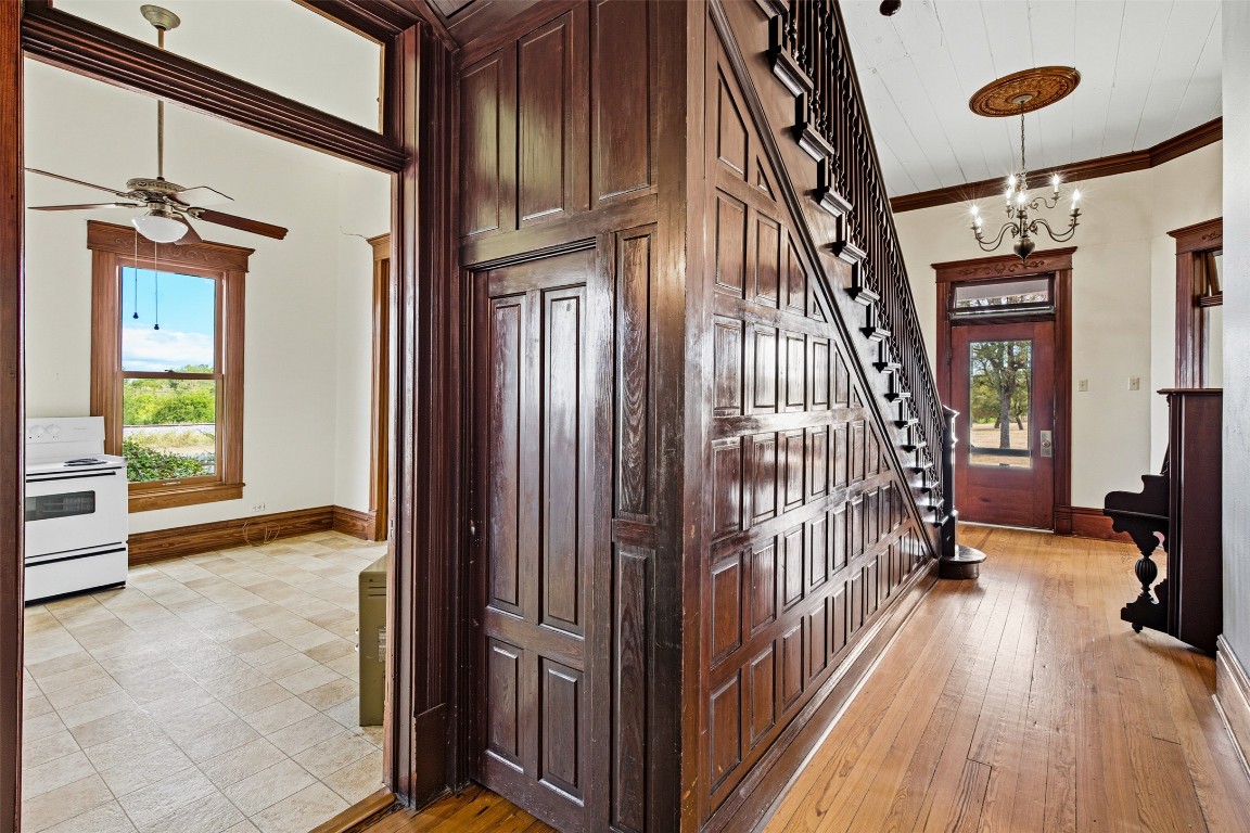 105 Davis Drive Thorndale, TX 76577 - Photo 7 of 40 a view of a hallway with wooden floor and staircase
