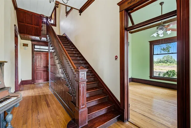 a view of an entryway with wooden floor