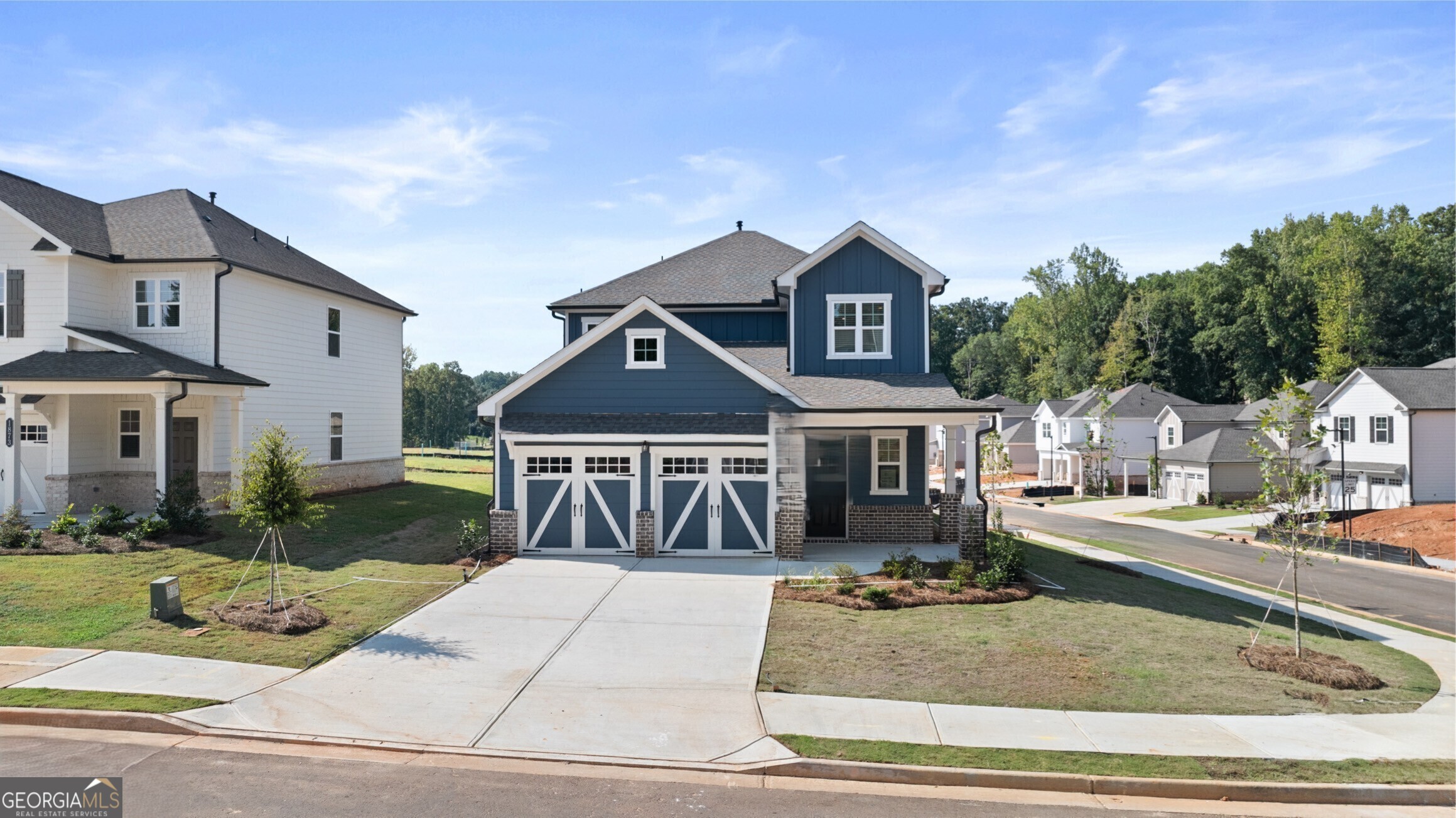 2464 Lennox Road Southeast Conyers, GA 30094 - Photo 1 of 27 a front view of a house with a yard