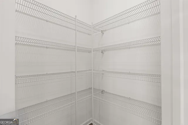 a view of a room with racks on the wall