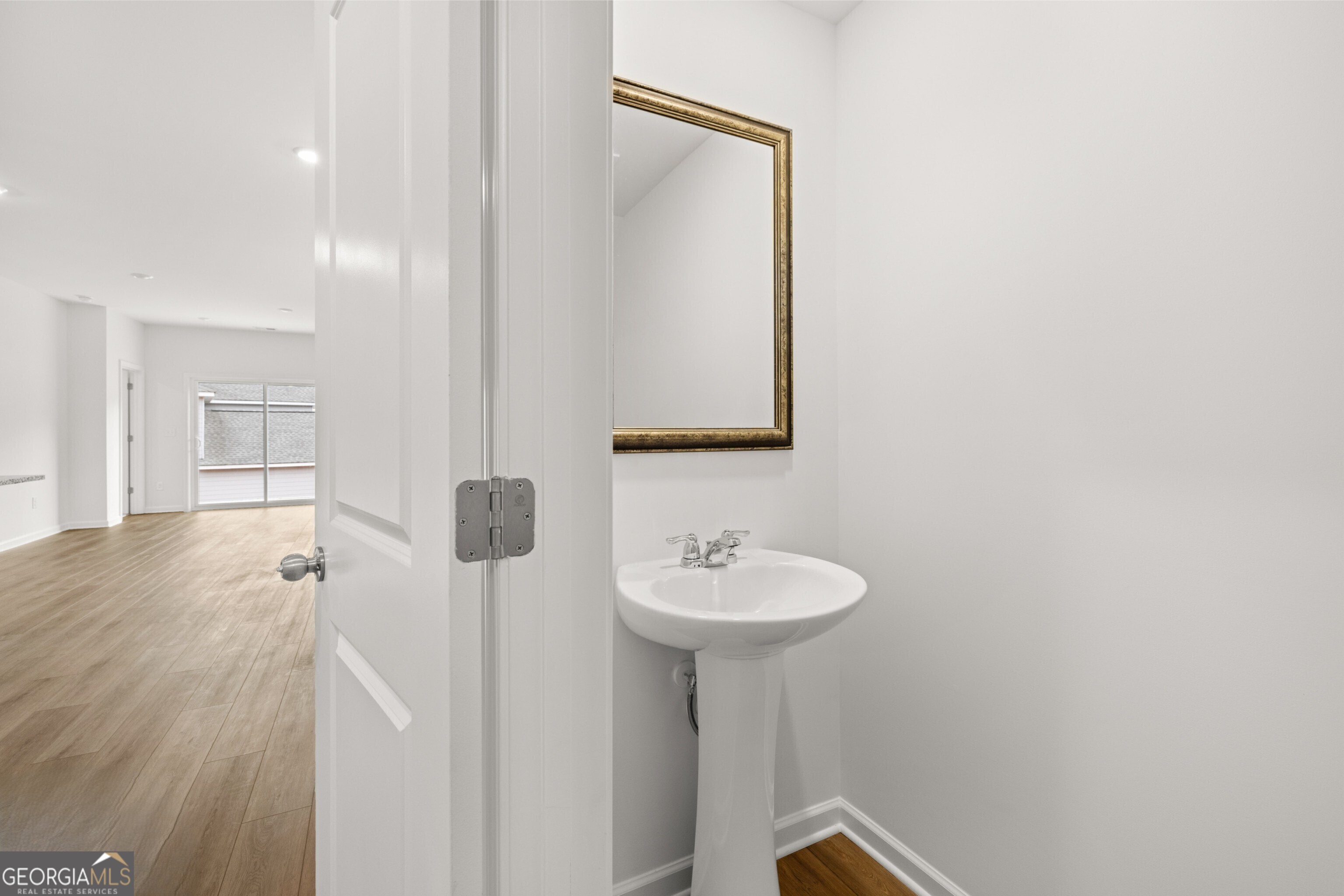 2464 Lennox Road Southeast Conyers, GA 30094 - Photo 15 of 27 a bathroom with a sink and a mirror
