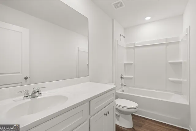 a bathroom with a sink a toilet and a bathtub
