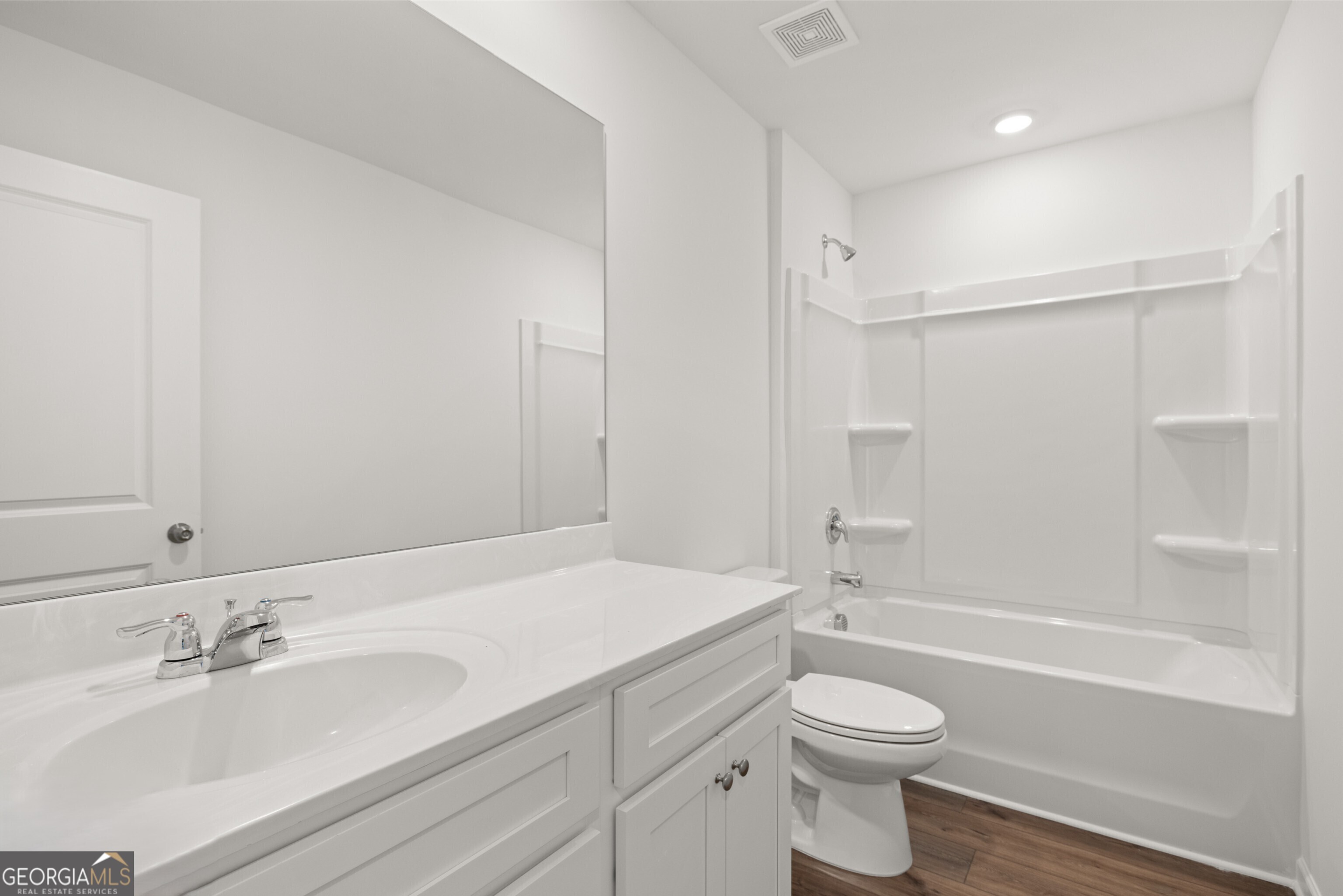 2464 Lennox Road Southeast Conyers, GA 30094 - Photo 24 of 27 a bathroom with a sink a toilet and a bathtub
