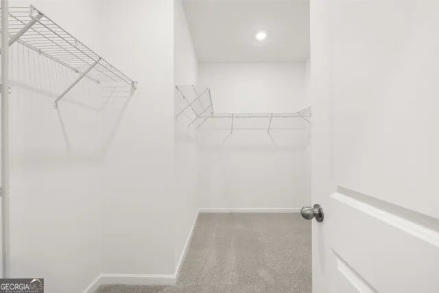 a view of a room with racks on the wall