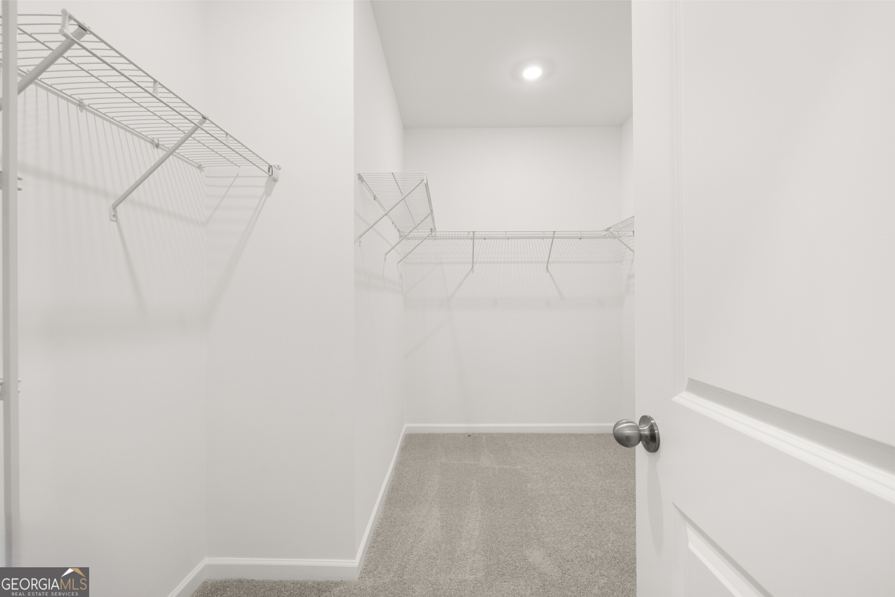 2464 Lennox Road Southeast Conyers, GA 30094 - Photo 27 of 27 a view of a room with racks on the wall