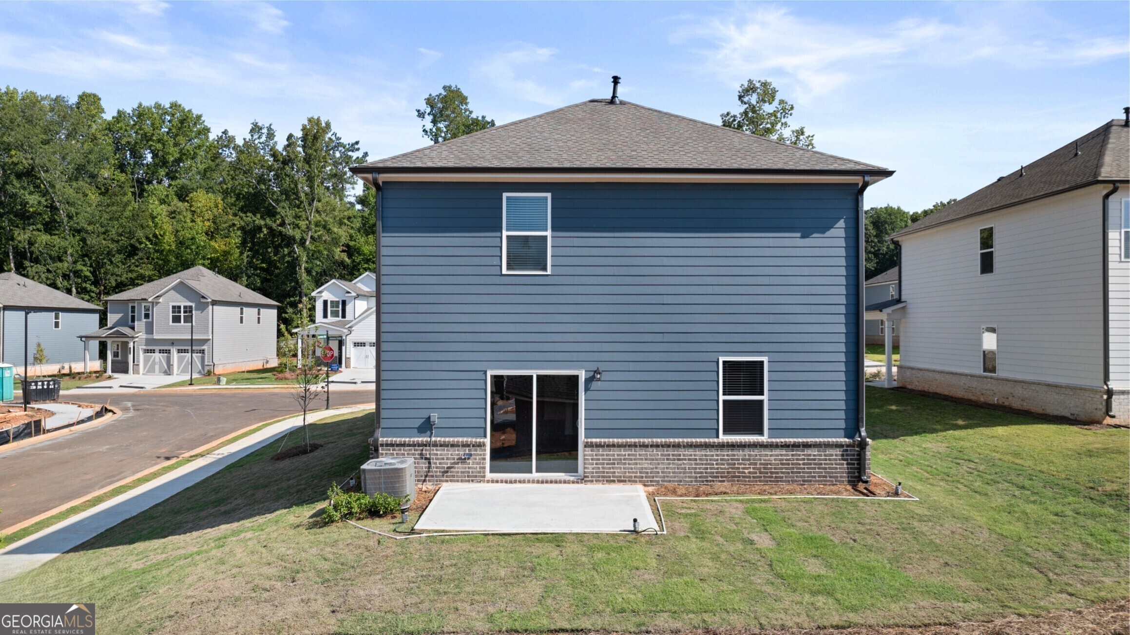 2464 Lennox Road Southeast Conyers, GA 30094 - Photo 3 of 27 a front view of a house with a yard
