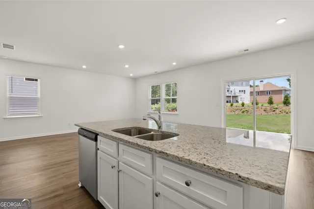 a kitchen with granite countertop a sink and a granite counter tops