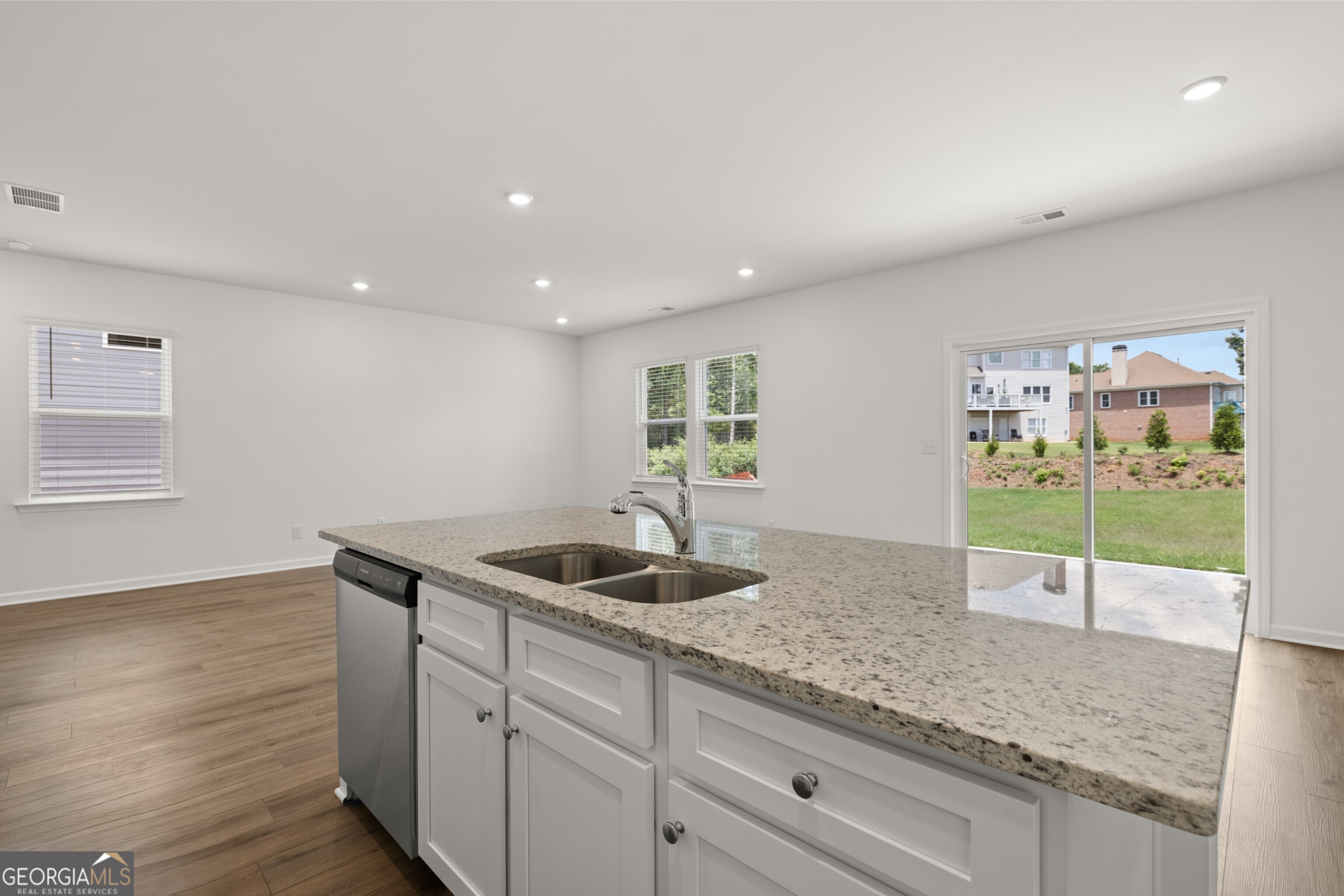 2464 Lennox Road Southeast Conyers, GA 30094 - Photo 8 of 27 a kitchen with granite countertop a sink and a granite counter tops