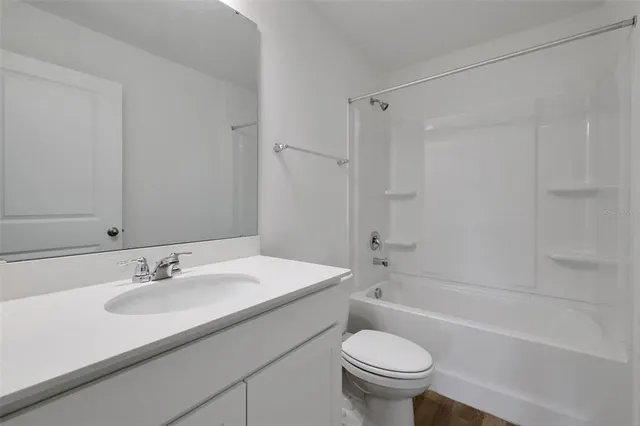 a bathroom with a sink toilet and a bathtub