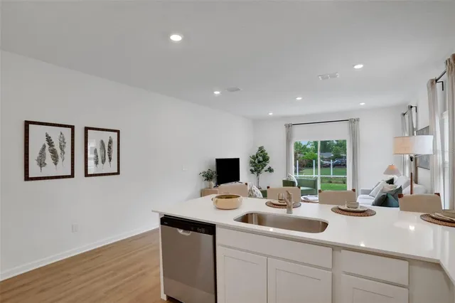 a kitchen with a sink and a window