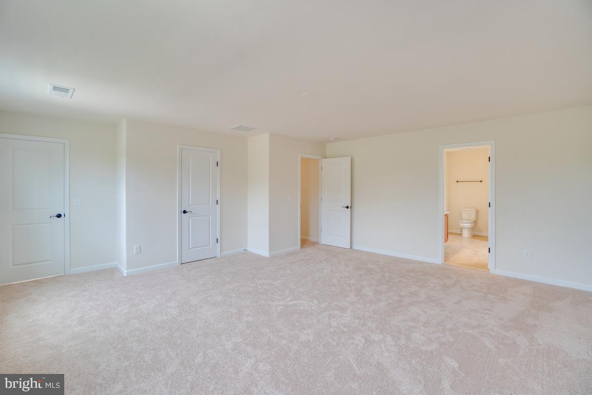 0 Latane Drive Colonial Beach, VA 22443 - Photo 26 of 38 Bright primary suite blending comfort + style