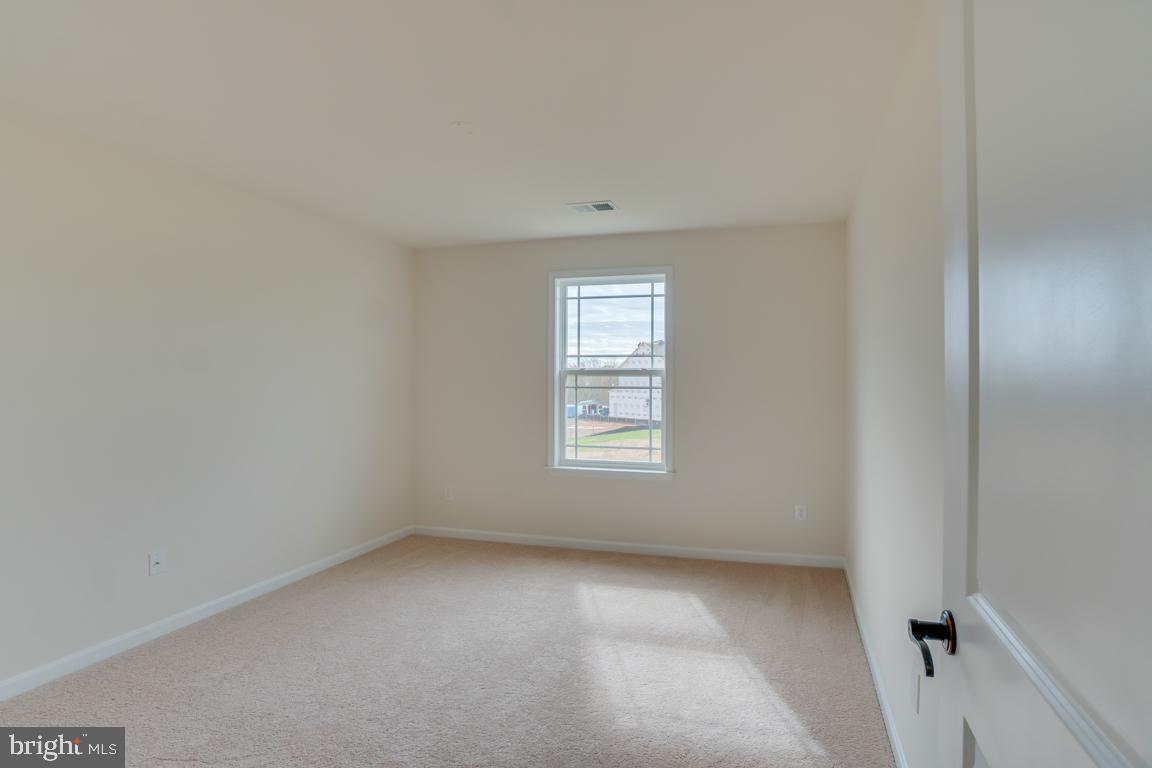 0 Latane Drive Colonial Beach, VA 22443 - Photo 32 of 38 Third bedroom features soft carpet + natural light