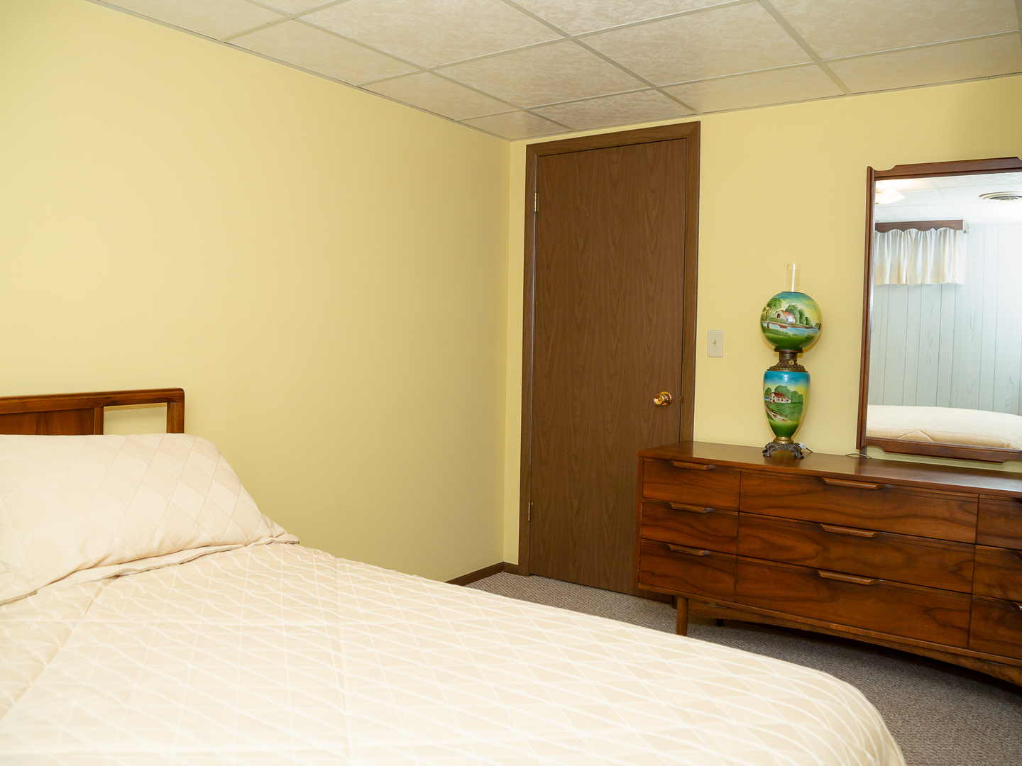 209 Kay Street Tonica, IL 61370 - Photo 26 of 40 a bedroom with a bed and a dresser