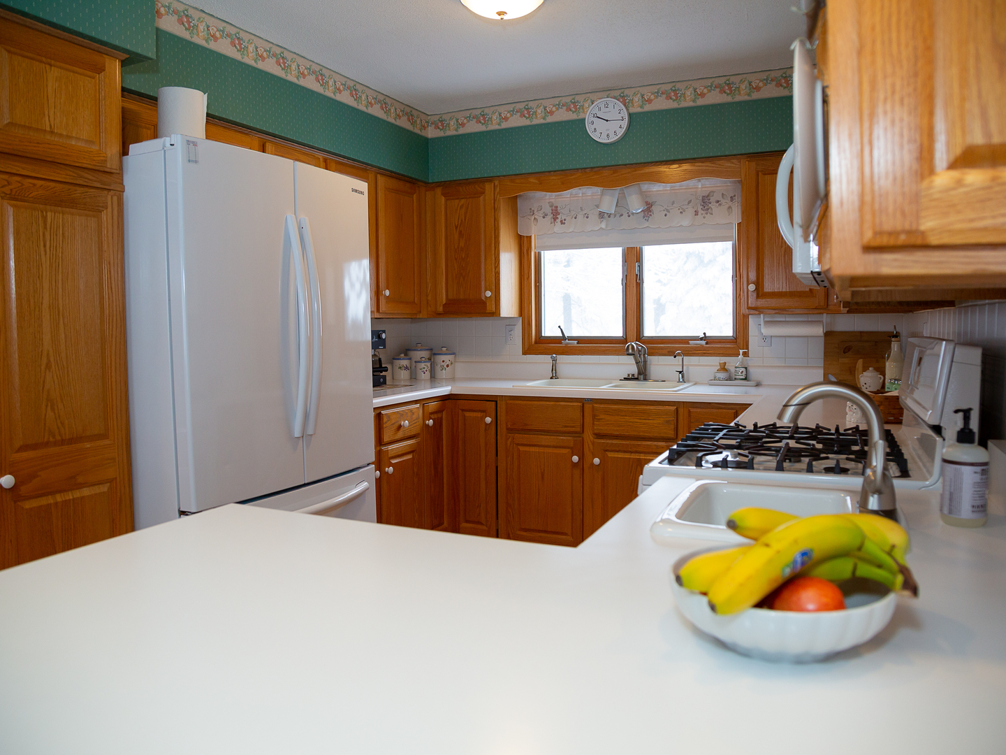209 Kay Street Tonica, IL 61370 - Photo 9 of 40 a kitchen with a sink a window and appliances
