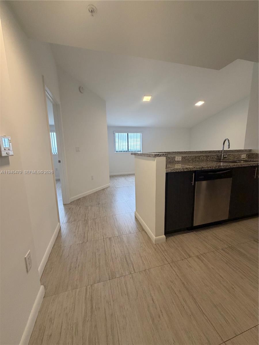 1801 Southwest 32nd Avenue, Unit 701 Miami, FL 33145 - Photo 2 of 13 a view of kitchen and wooden floor