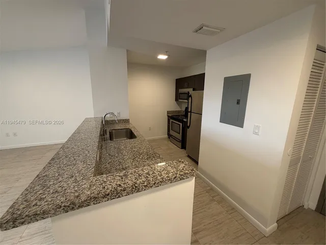 a view of a kitchen cabinets