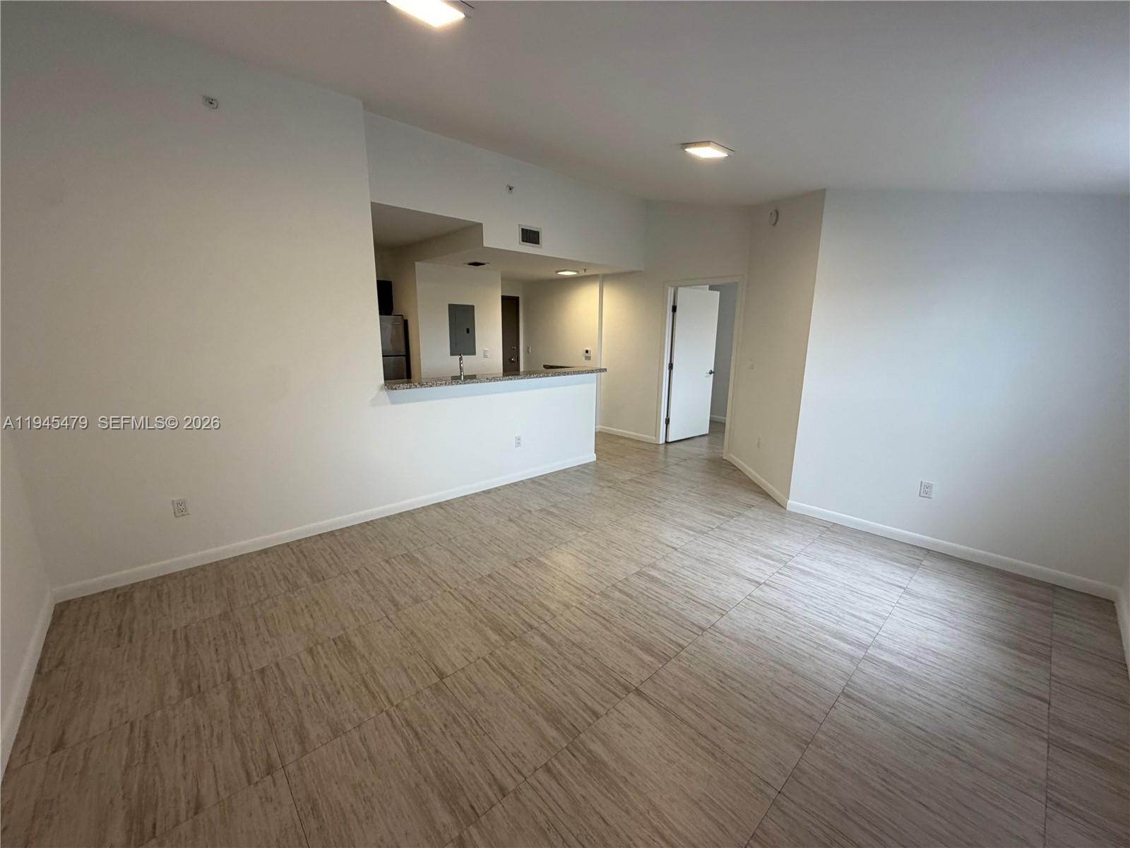 1801 Southwest 32nd Avenue, Unit 701 Miami, FL 33145 - Photo 7 of 13 a view of empty room with wooden floor