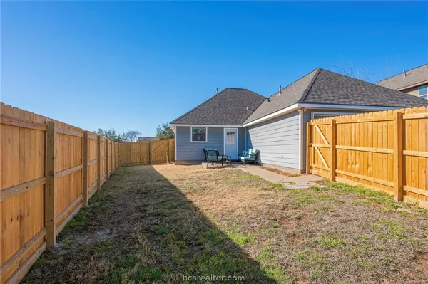 a house view with a backyard space
