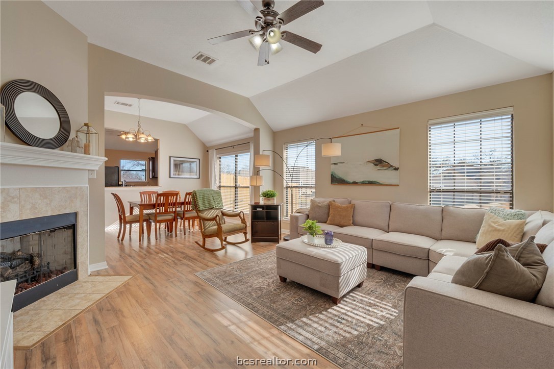 2000 Turning Leaf Drive Bryan, TX 77807 - Photo 2 of 20 a living room with furniture a fireplace dining table and a fireplace