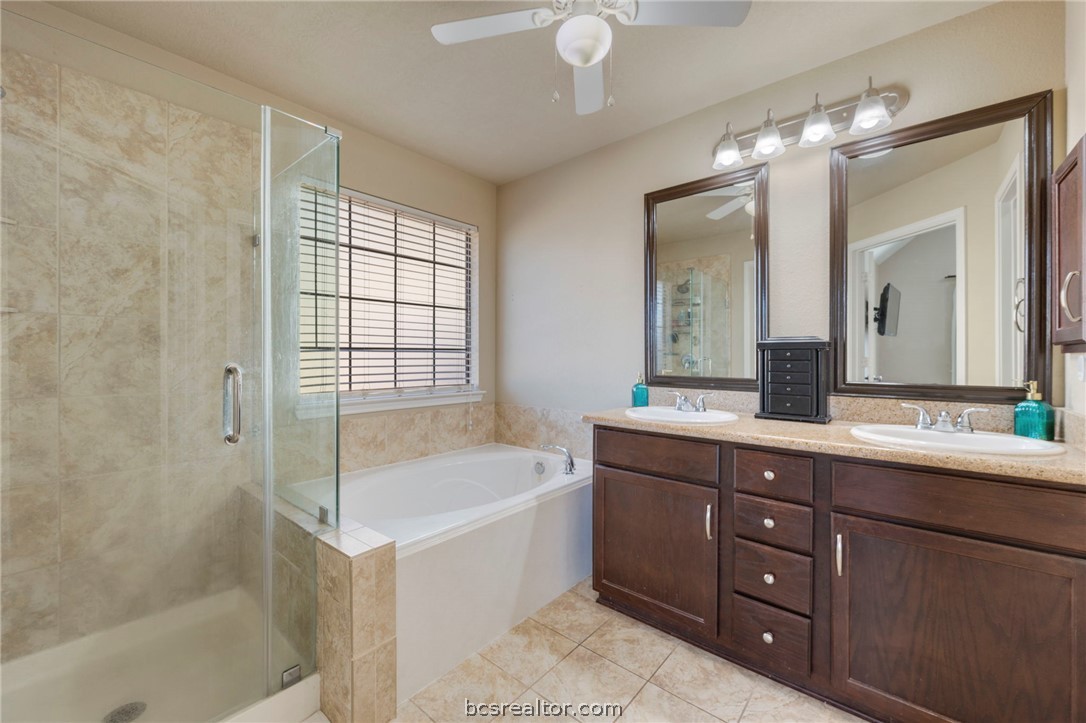 2000 Turning Leaf Drive Bryan, TX 77807 - Photo 10 of 20 a spacious bathroom with a tub sink shower and mirror