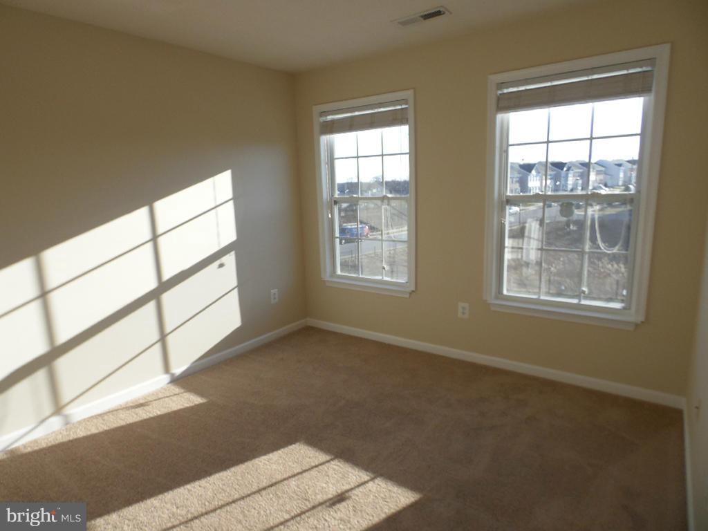 9705 Langley Road Baltimore, MD 21220 - Photo 11 of 26 a view of an empty room with a window