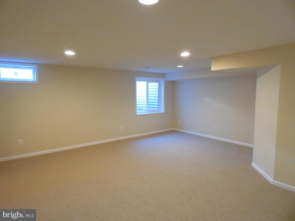 9705 Langley Road Baltimore, MD 21220 - Photo 15 of 26 an empty room with windows and closet in a room