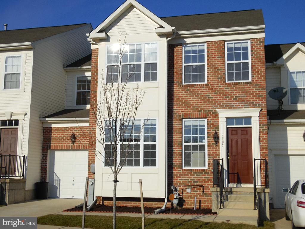 9705 Langley Road Baltimore, MD 21220 - Photo 25 of 26 a front view of a building with a glass door