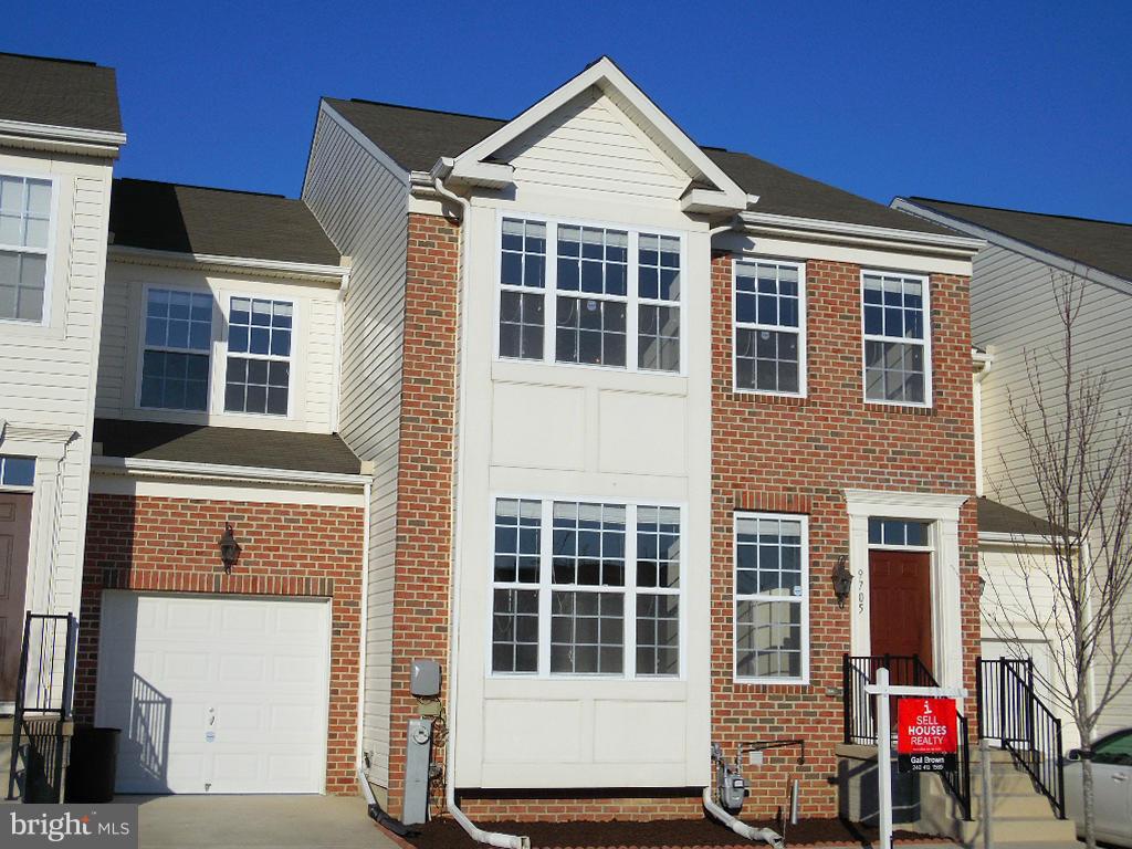9705 Langley Road Baltimore, MD 21220 - Photo 26 of 26 a front view of a house with a garage
