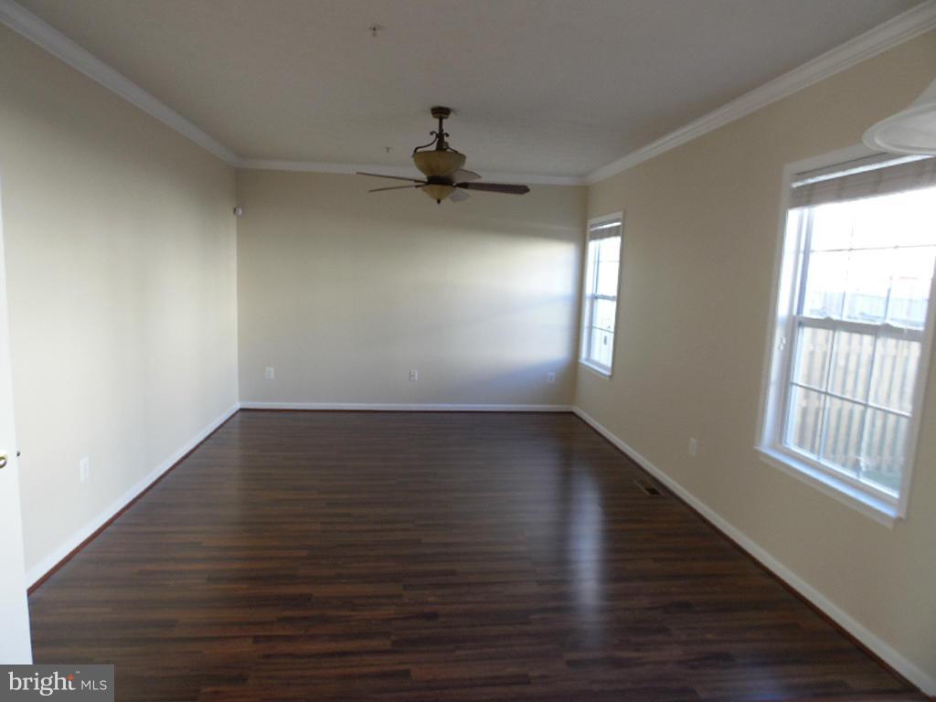 9705 Langley Road Baltimore, MD 21220 - Photo 6 of 26 wooden floor in an empty room with a window