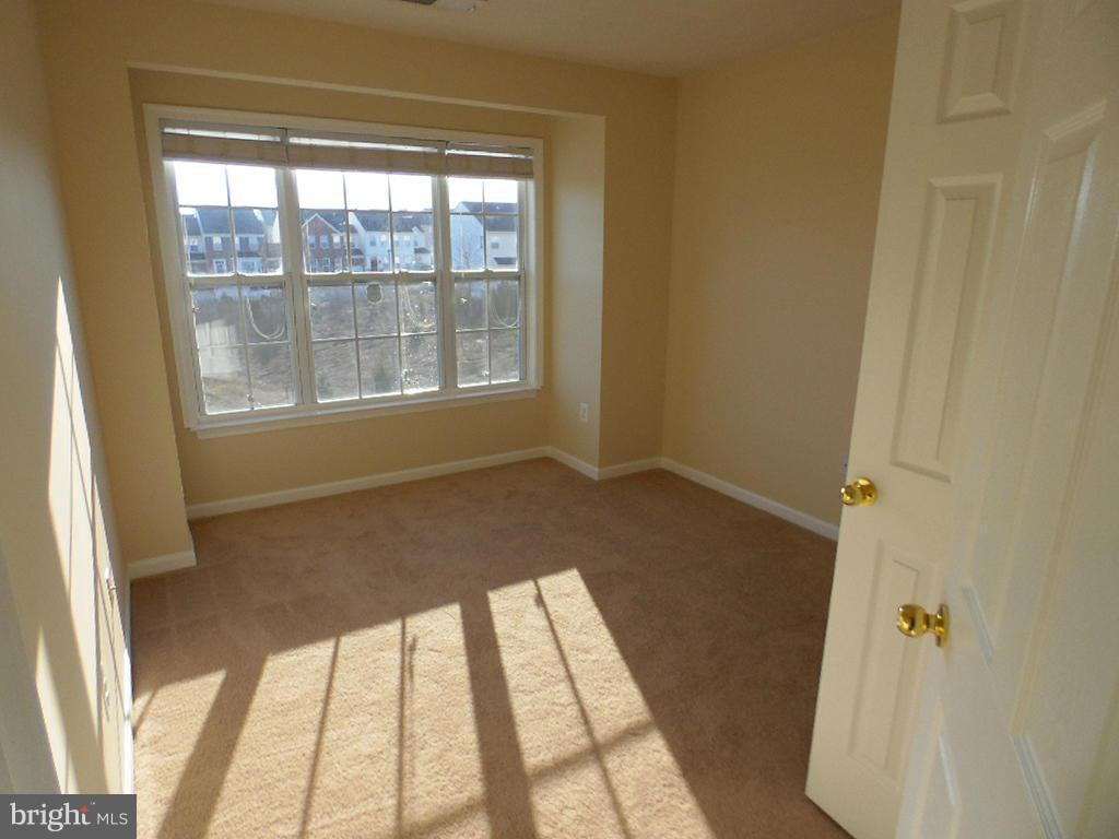 9705 Langley Road Baltimore, MD 21220 - Photo 9 of 26 a view of an empty room and window